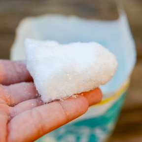 Epsom Salts Soil Fertilizer from SeedsNow, showing white crystalline Epsom salts in a clear container for healthy plant growth.