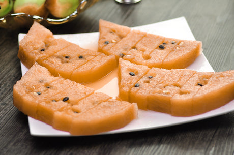 Watermelon Tendersweet orange-flesh seeds from SeedsNow, showing close-up of ripe watermelon with vibrant orange interior.